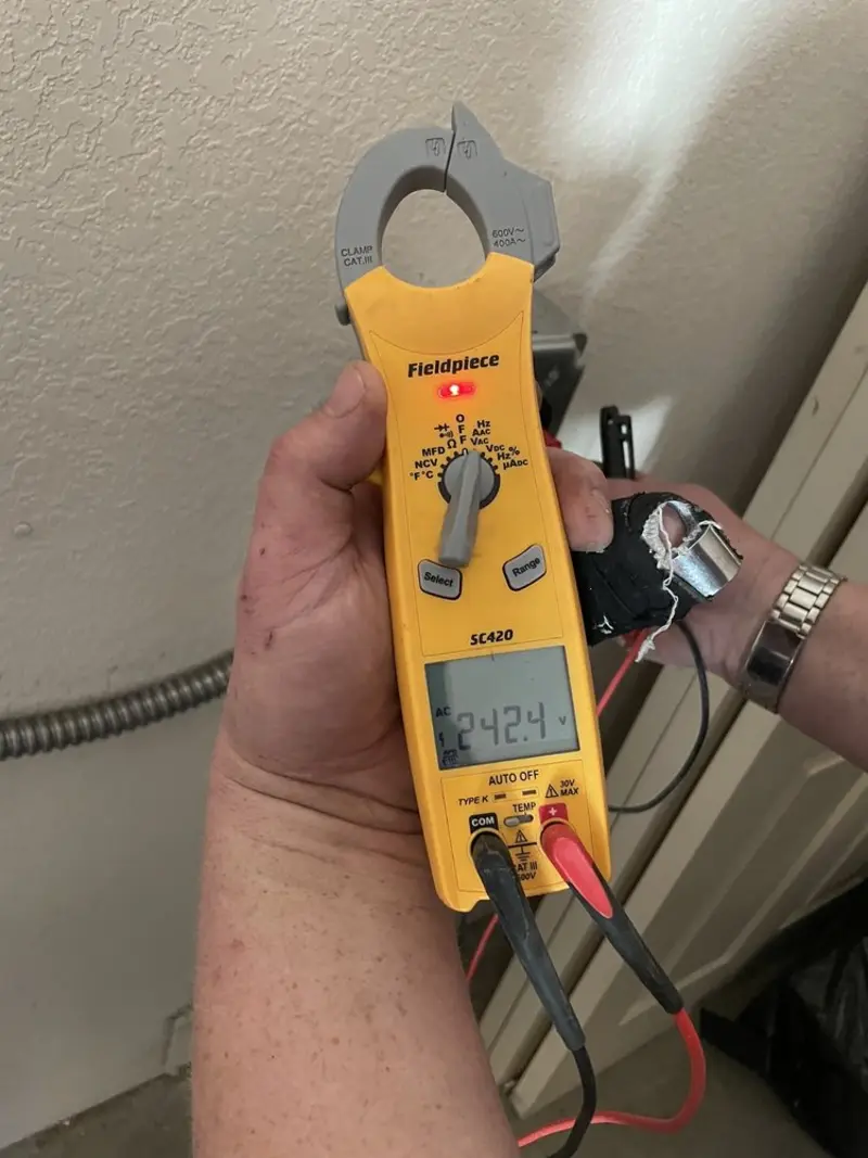 Voltage testing with clamp meter during Hot Tub / Pool Electrical Wiring in Lake of the Woods